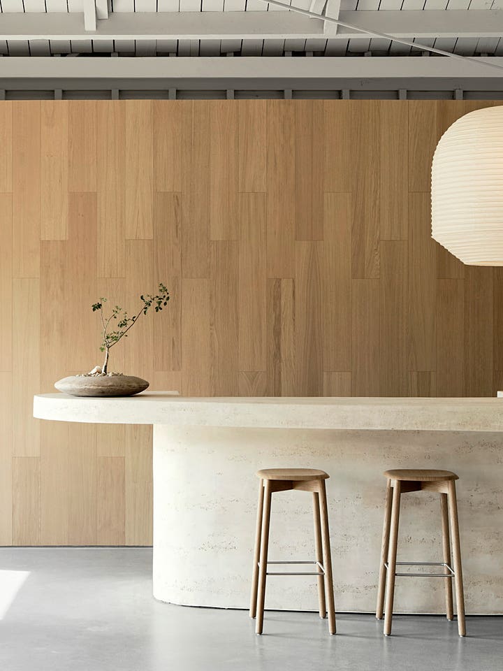 Wood paneled room with curved island