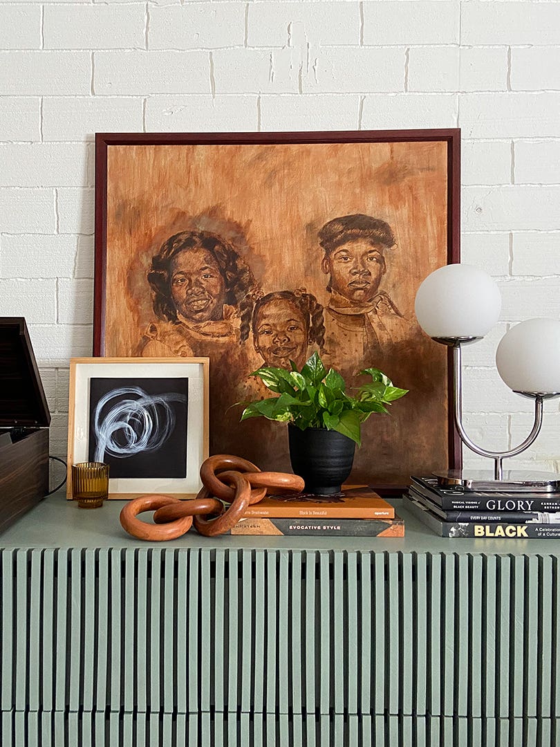 art leaning and music player on dresser top
