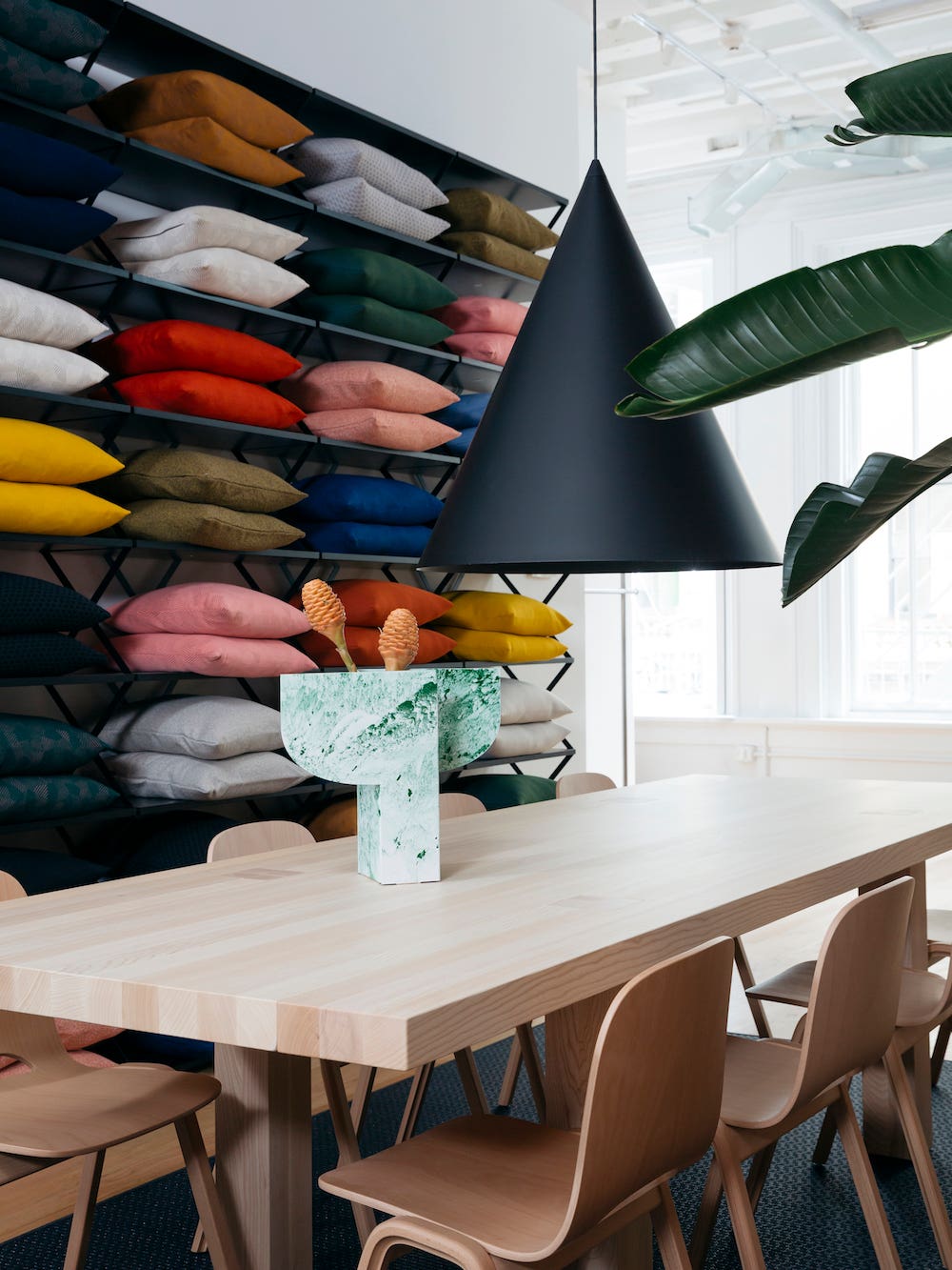 dining table with conical black pendant hanging over